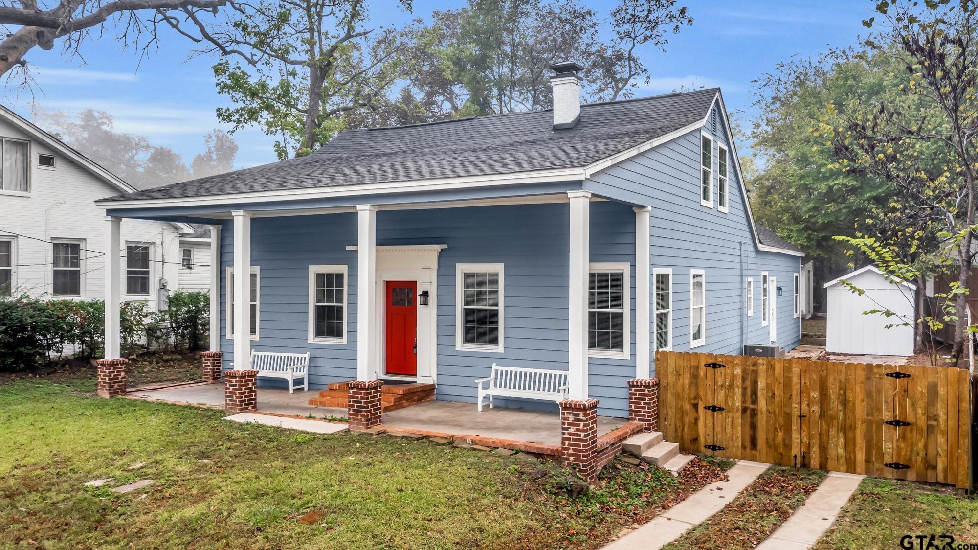 front view of a house with a yard