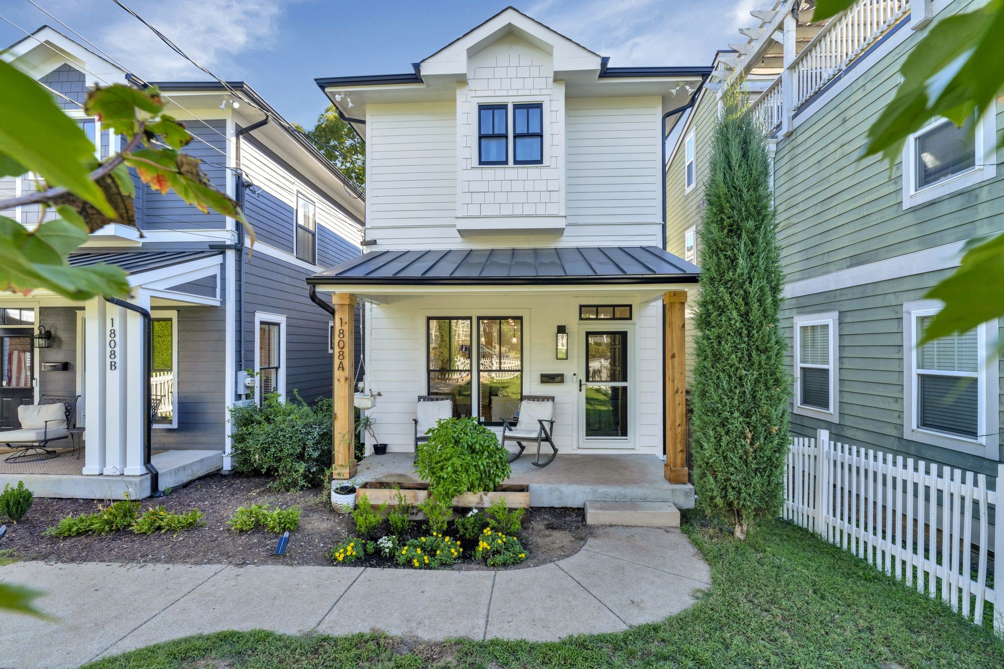 a front view of a house with garden