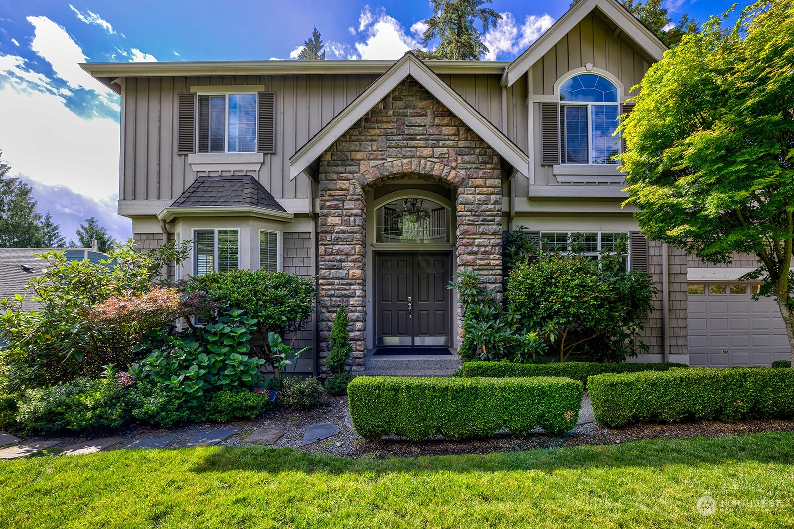 a front view of a house with a yard