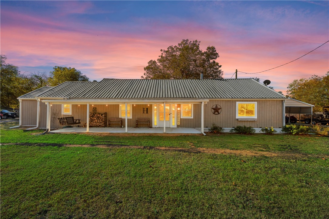 a view of a house with a back yard