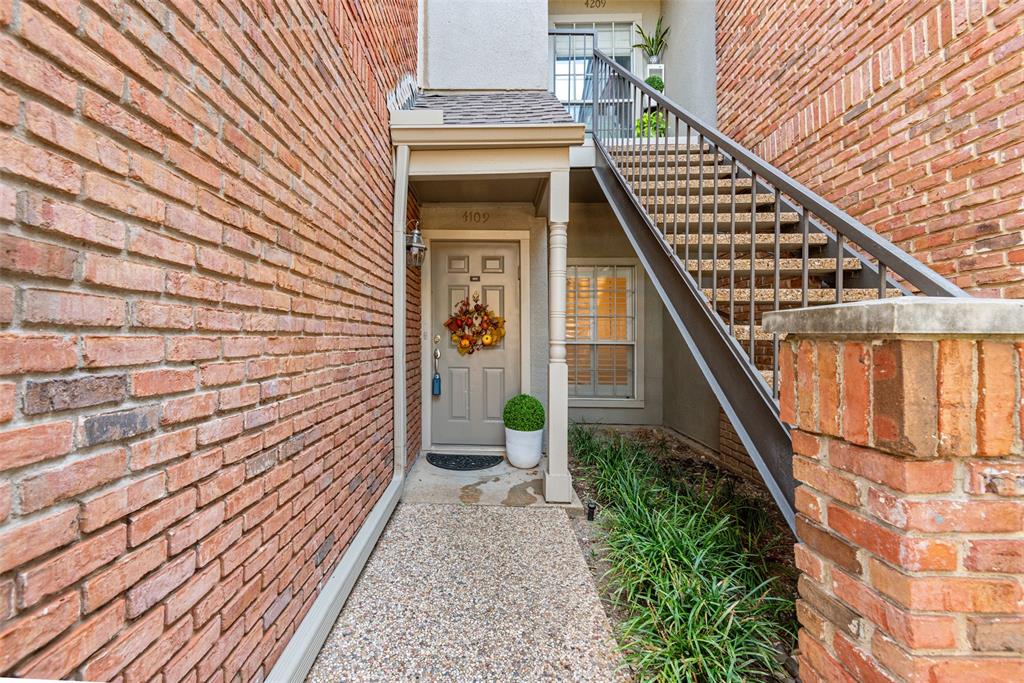 a view of a balcony with wooden floor and staircase