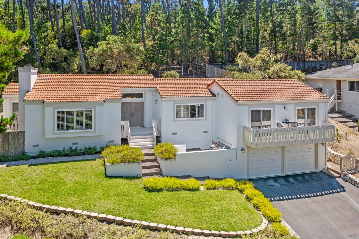 a aerial view of a house with swimming pool and porch