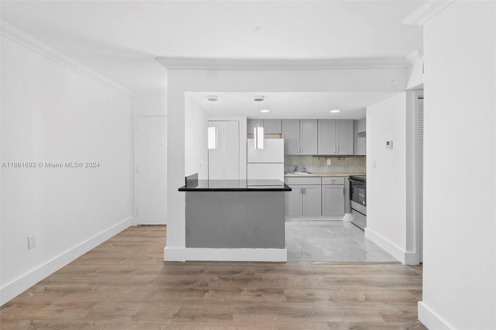 a view of kitchen with wooden floor