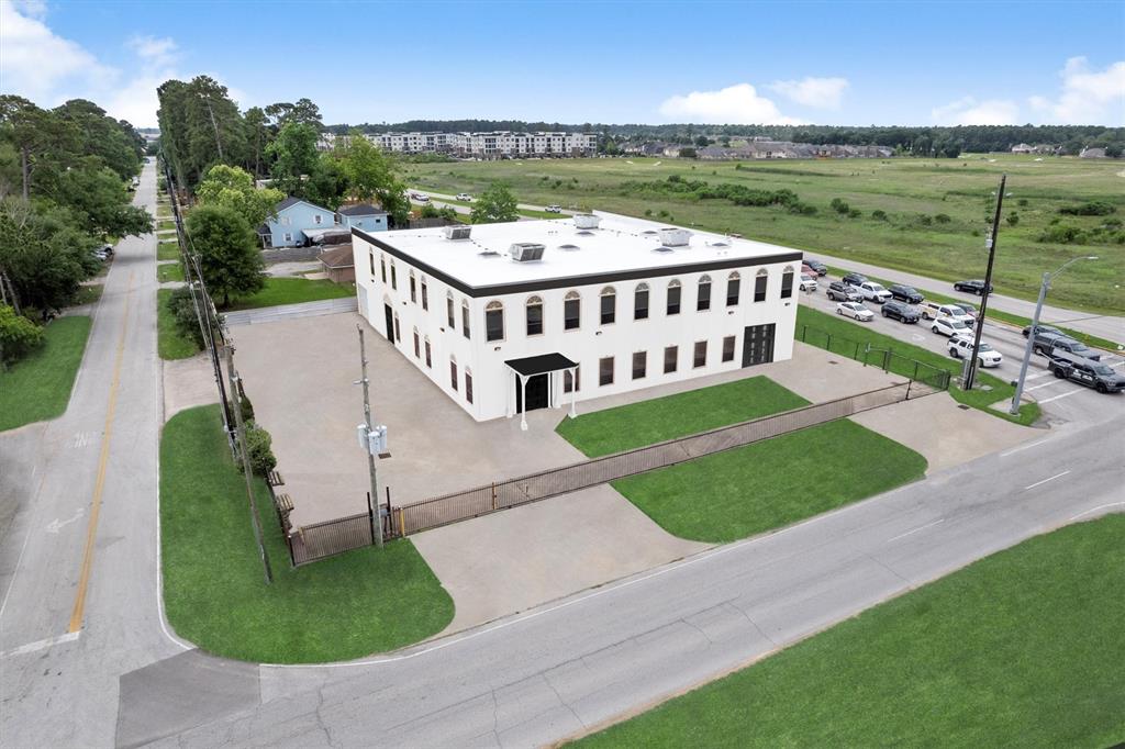 an aerial view of a house with a yard