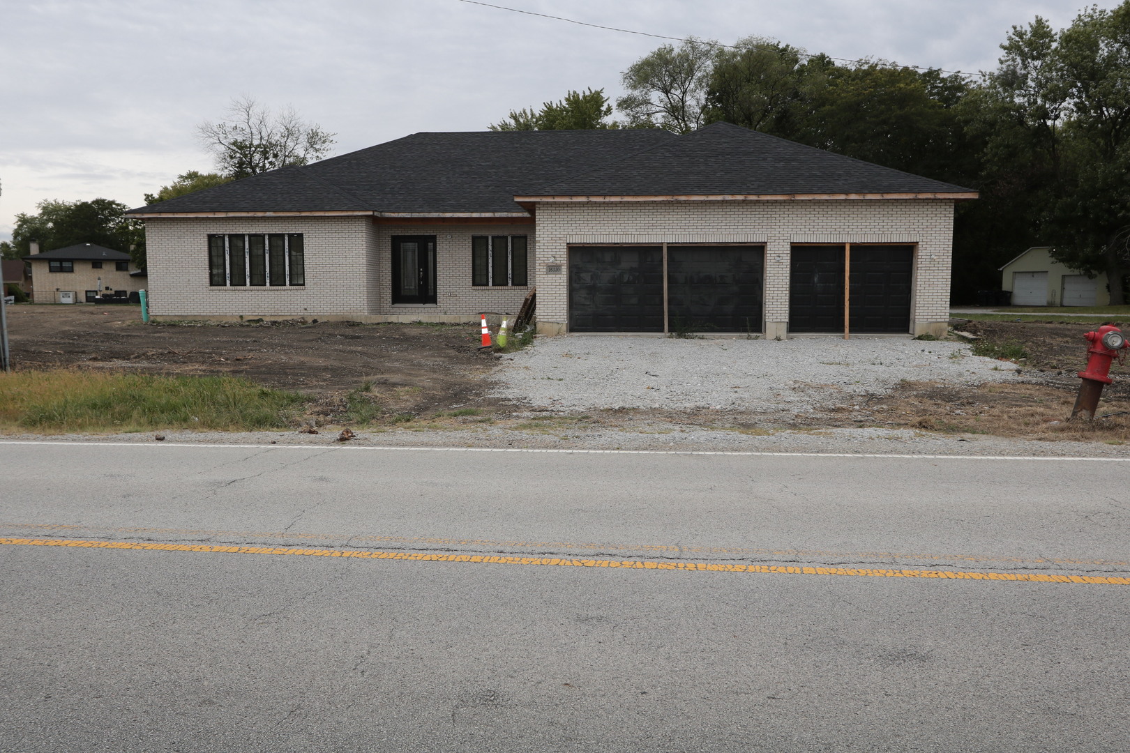 front view of a house with a yard