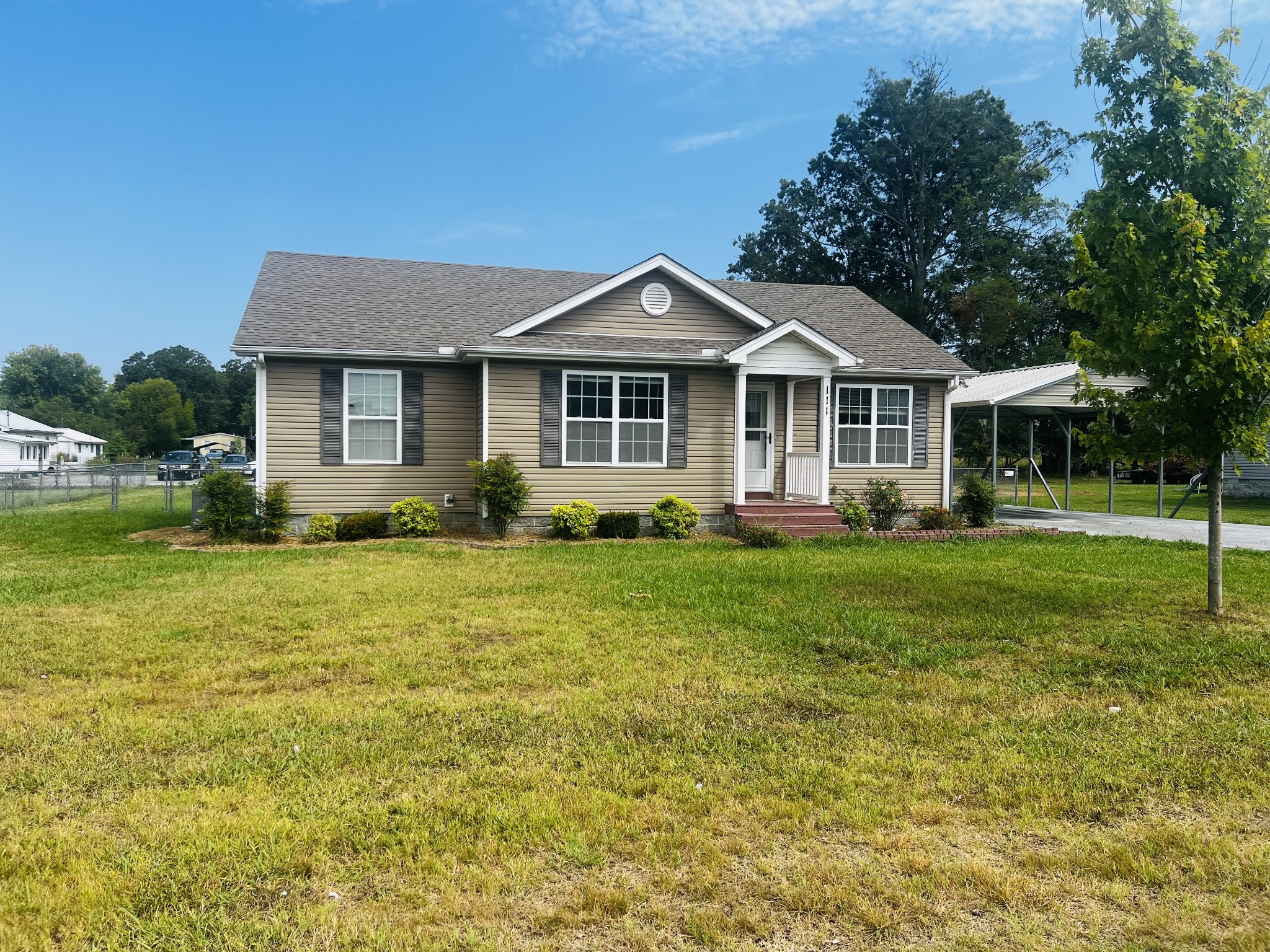 a front view of a house with a yard