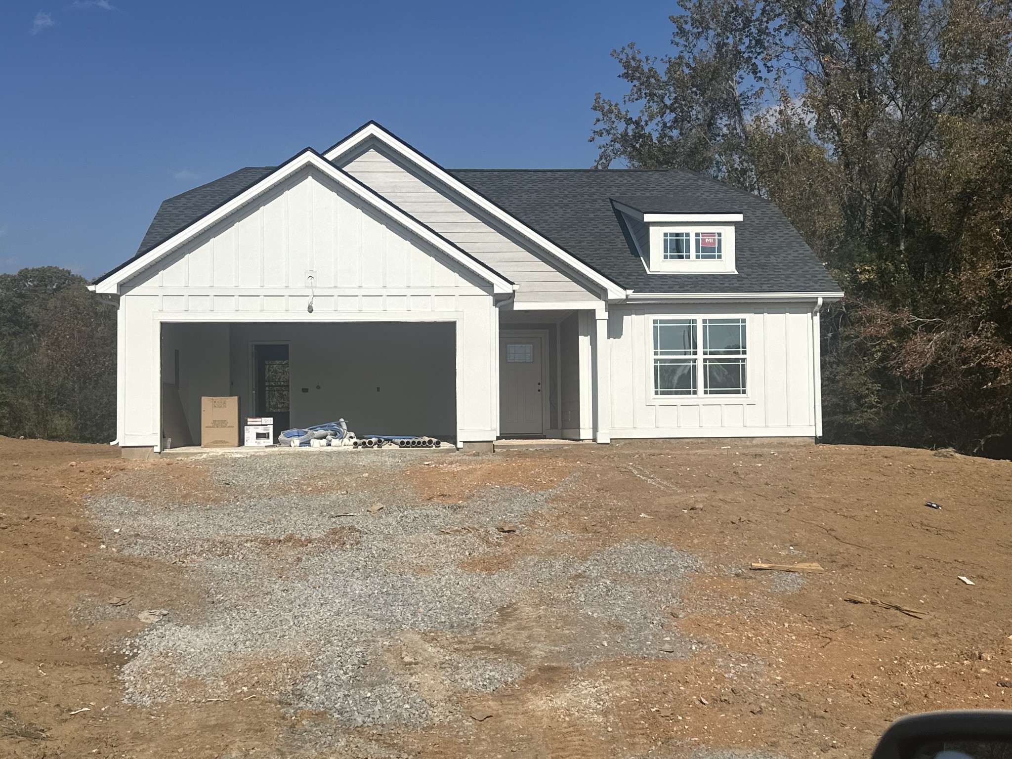 a view of a house with a yard and garage