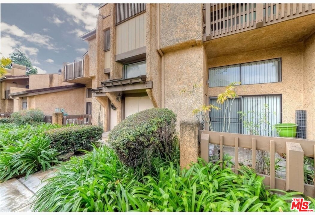 a picture of a building with a garden