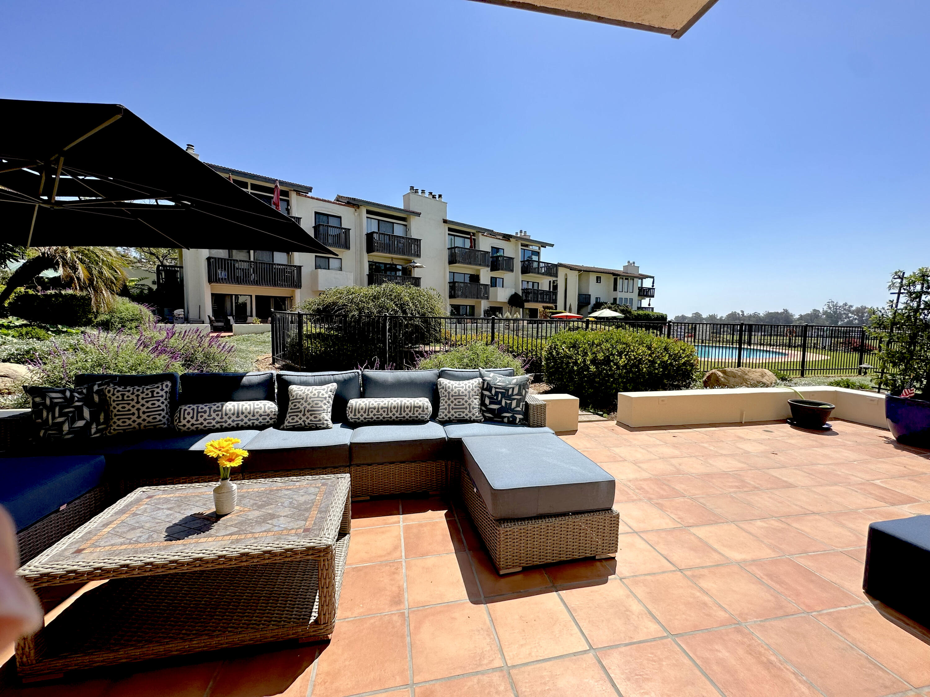 a terrace view with seating space barbeque oven and outdoor seating