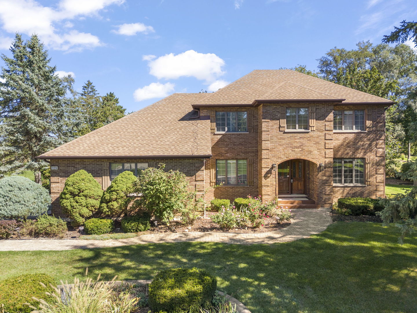 a front view of a house with garden