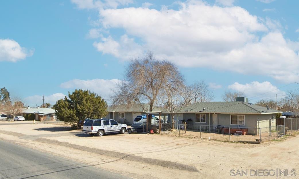 a view of a building with a yard