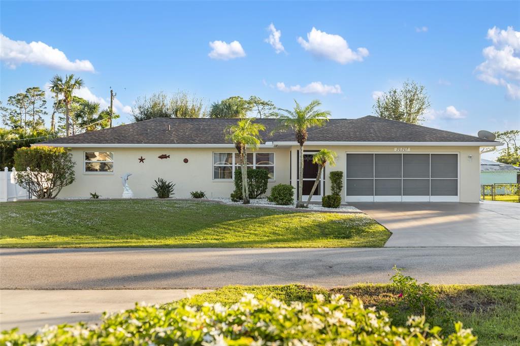 a view of house with backyard and swimming pool