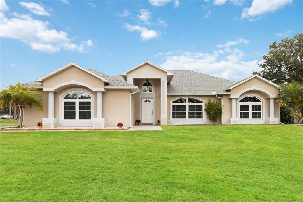 a front view of a house with a yard