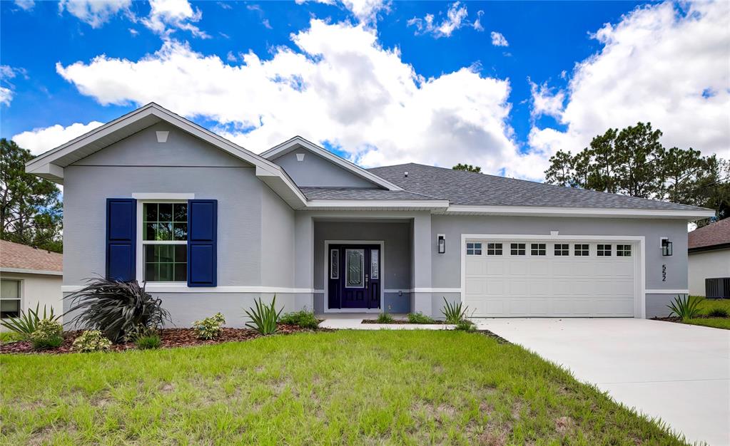 front view of a house with a yard