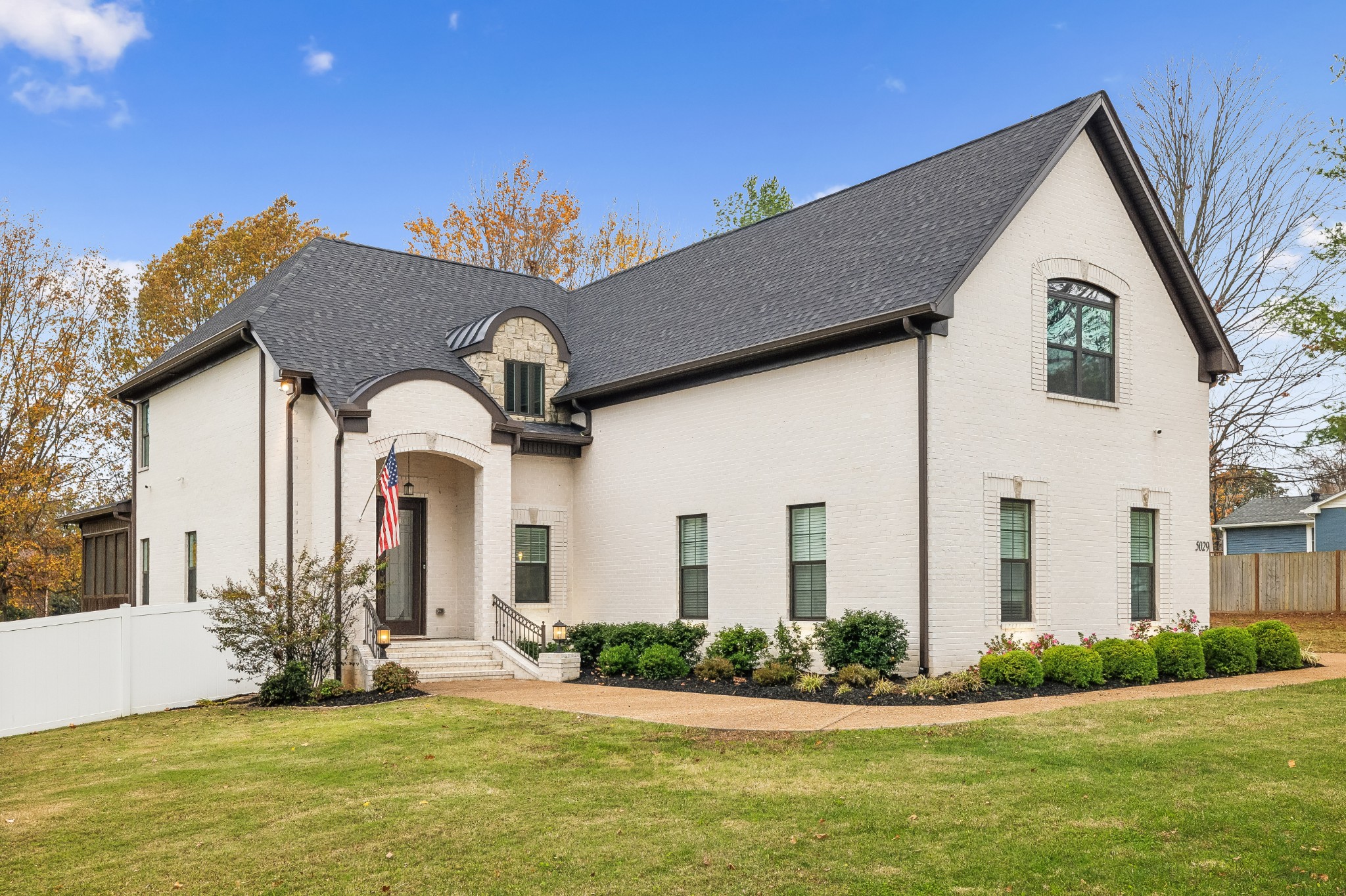 a front view of house with yard and green space