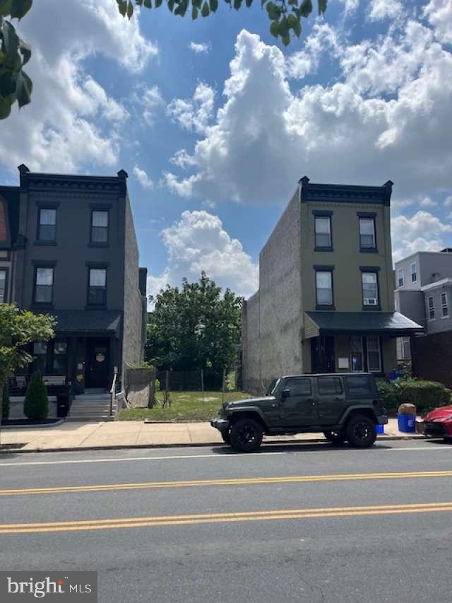 a view of street with parked cars