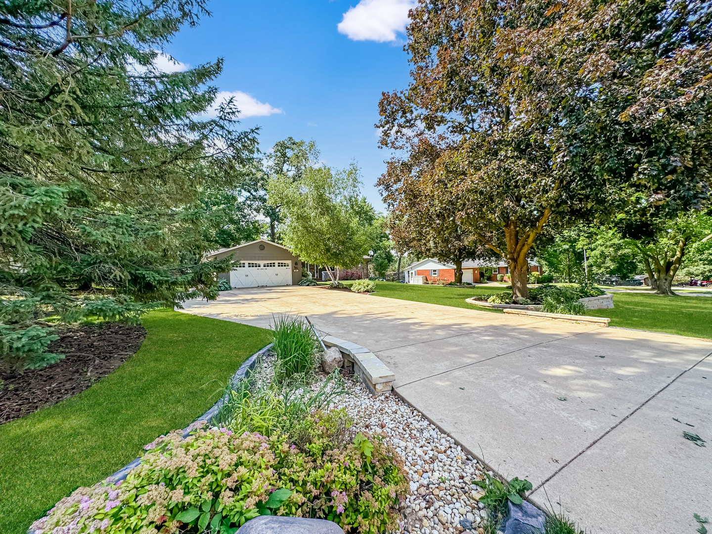 a view of a garden with houses