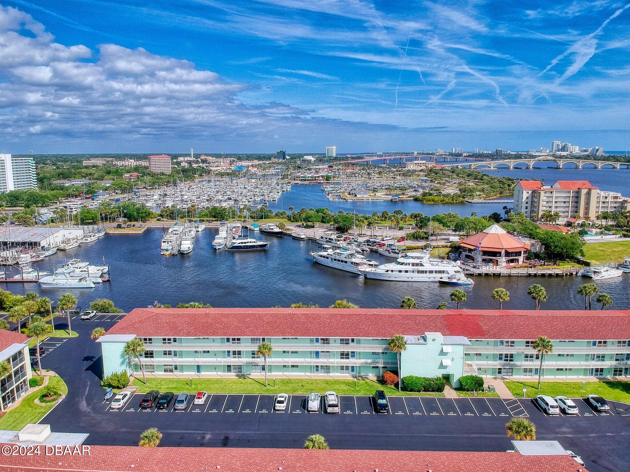 an aerial view of residential building and lake