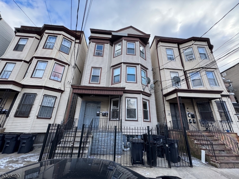 a front view of a residential apartment building with a front door