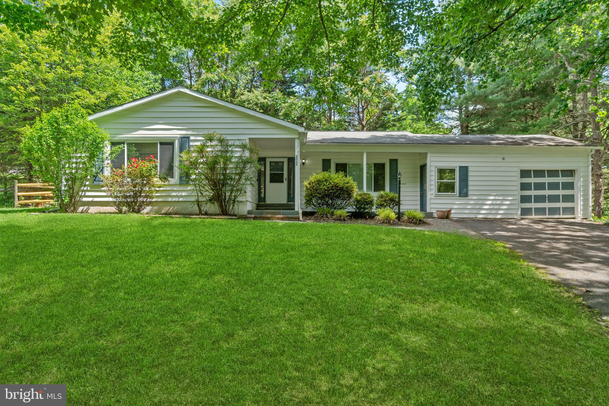 a front view of a house with a yard porch and patio