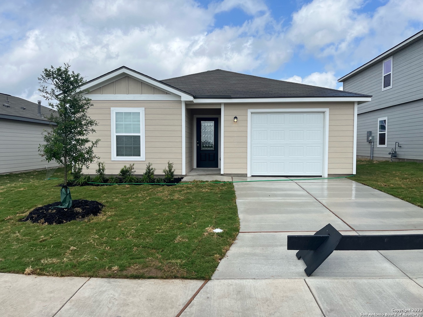 a front view of a house with a yard