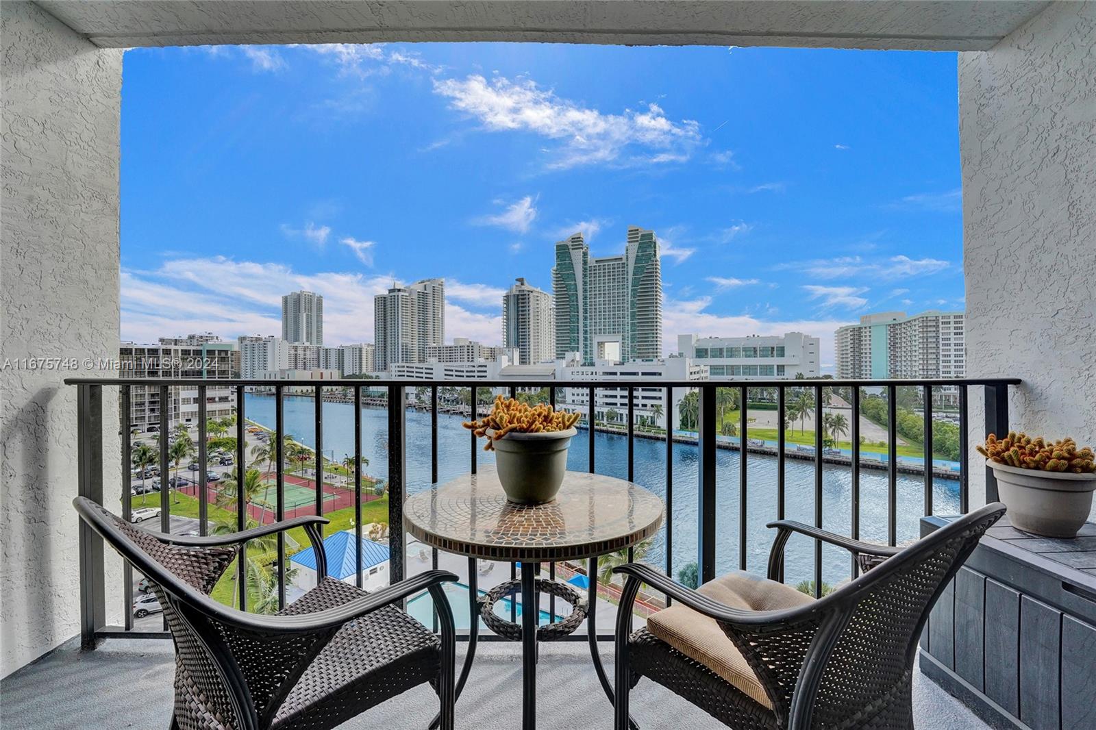 a view of a balcony with chairs