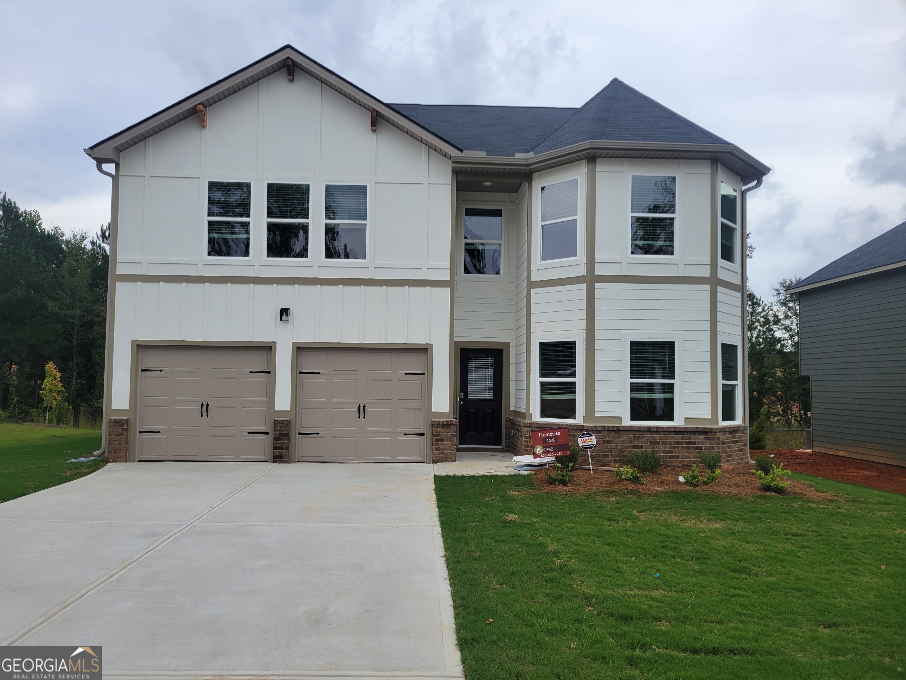 a view of house with yard