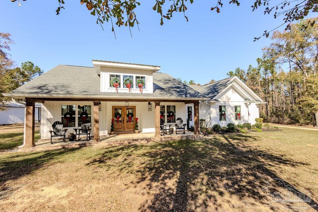 a front view of a house with a outdoor space