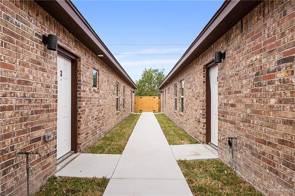 a view of pathway with building in background