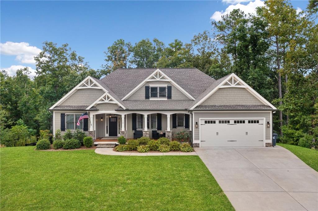 a front view of a house with garden