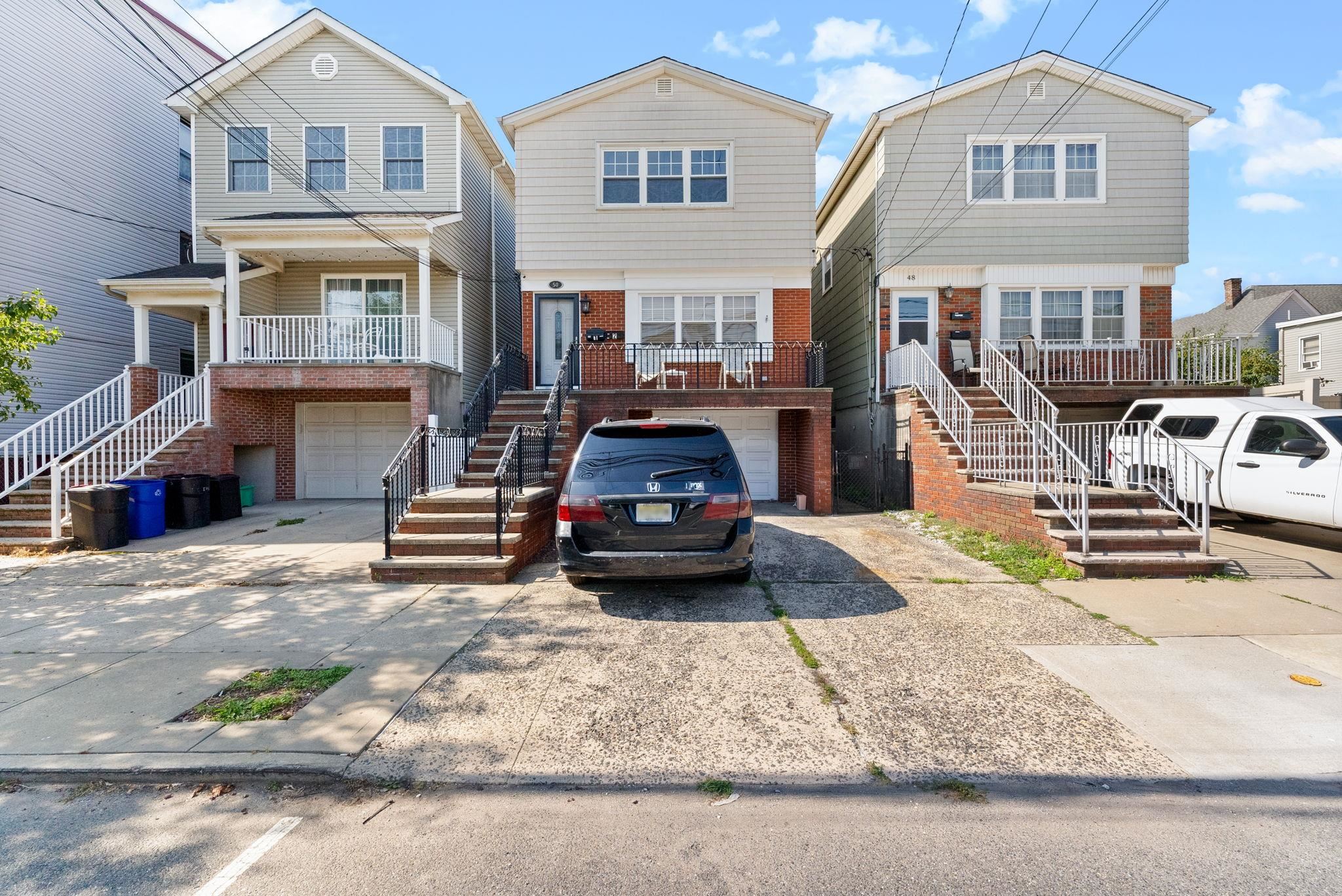 a car parked in front of a brick house