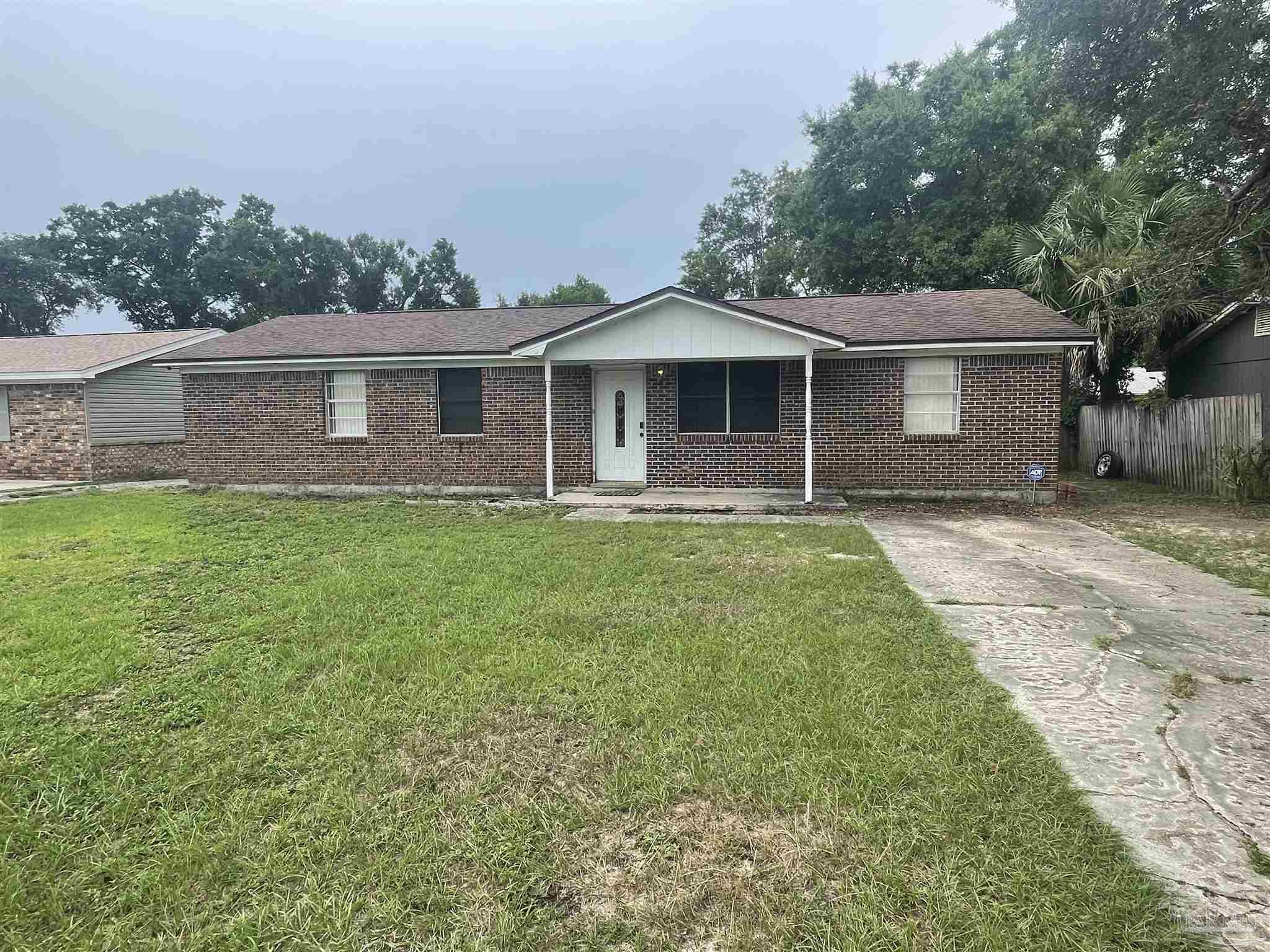 a front view of a house with yard