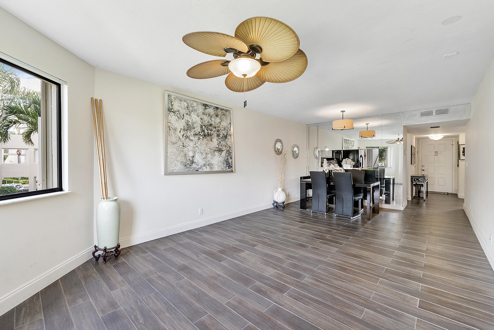 a view of a room with wooden floor water heater and a chandelier