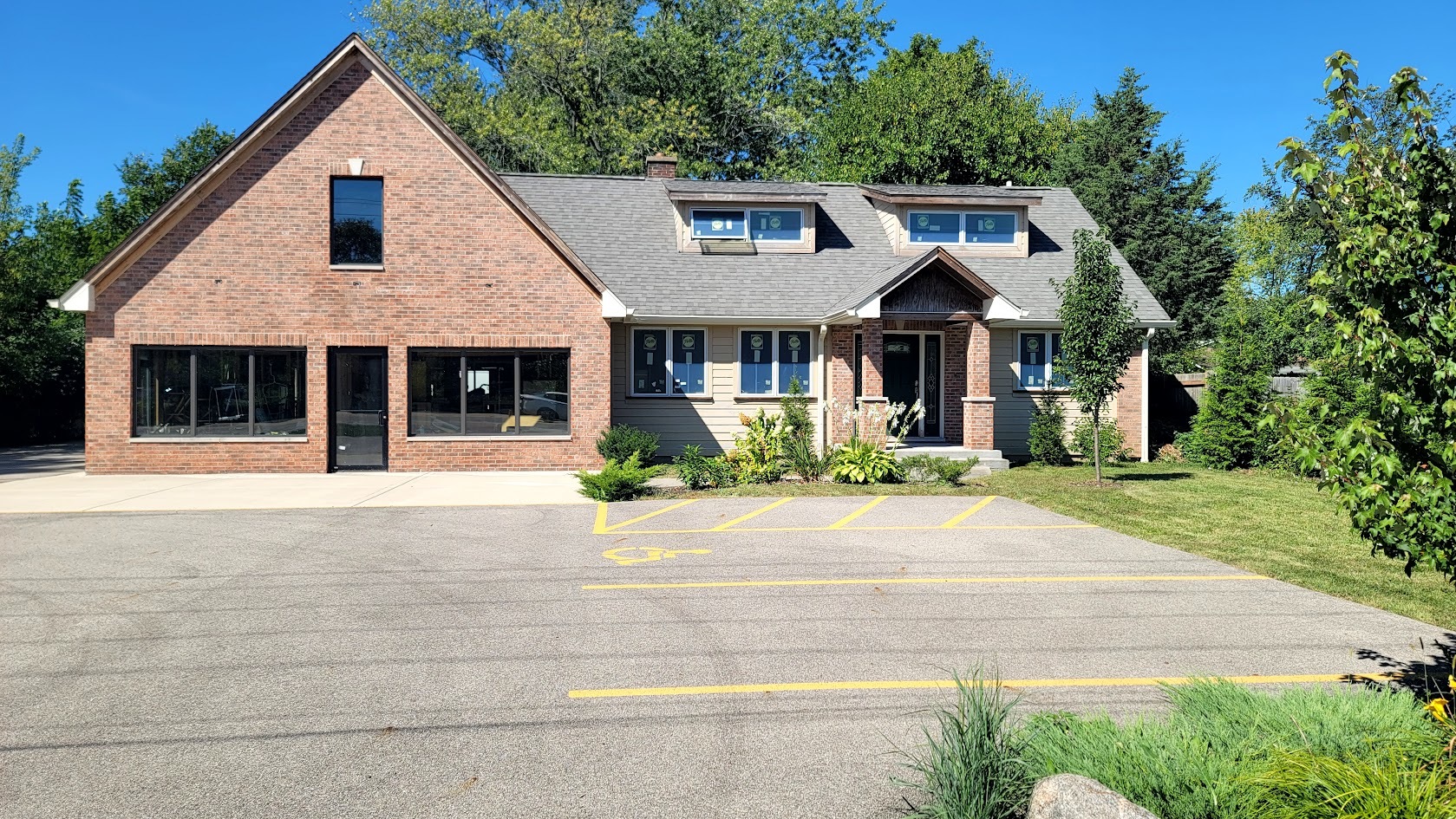 a front view of a house with a garden