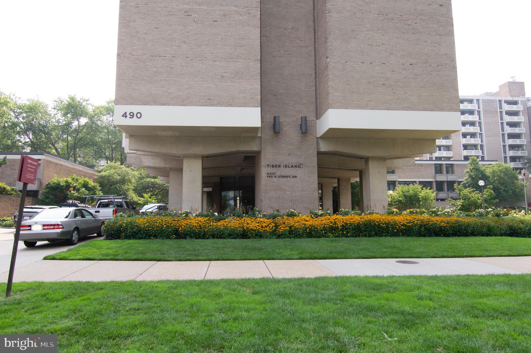 a front view of a building with garden