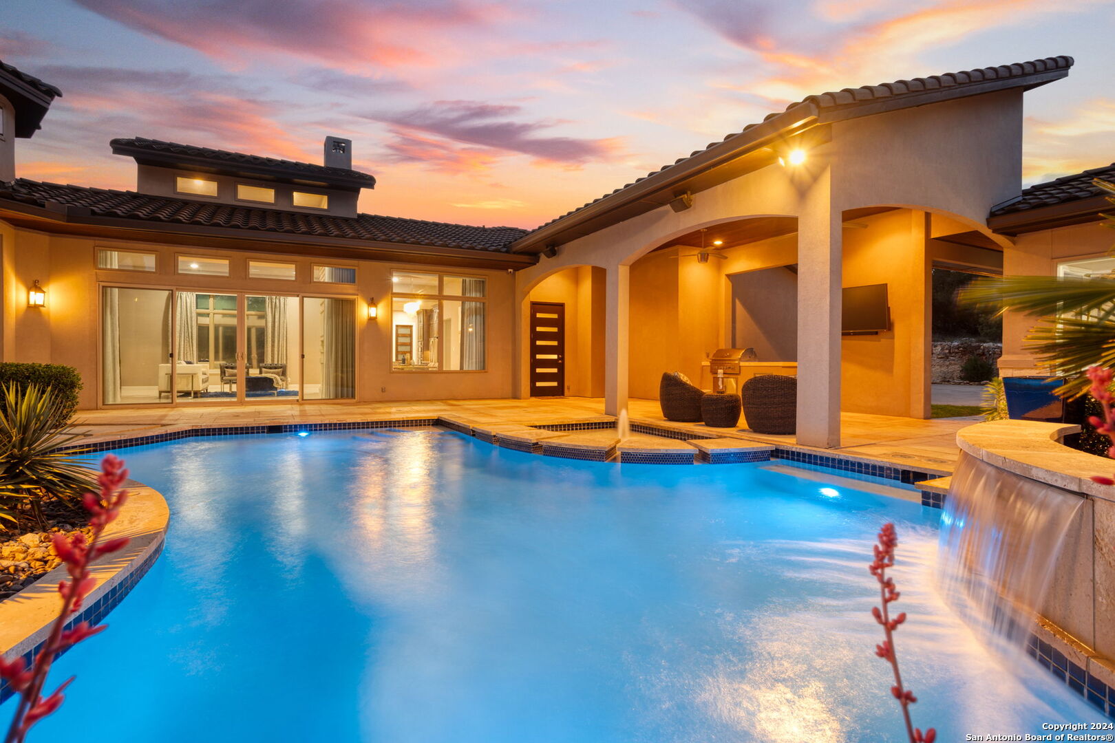 a view of a swimming pool with an outdoor seating