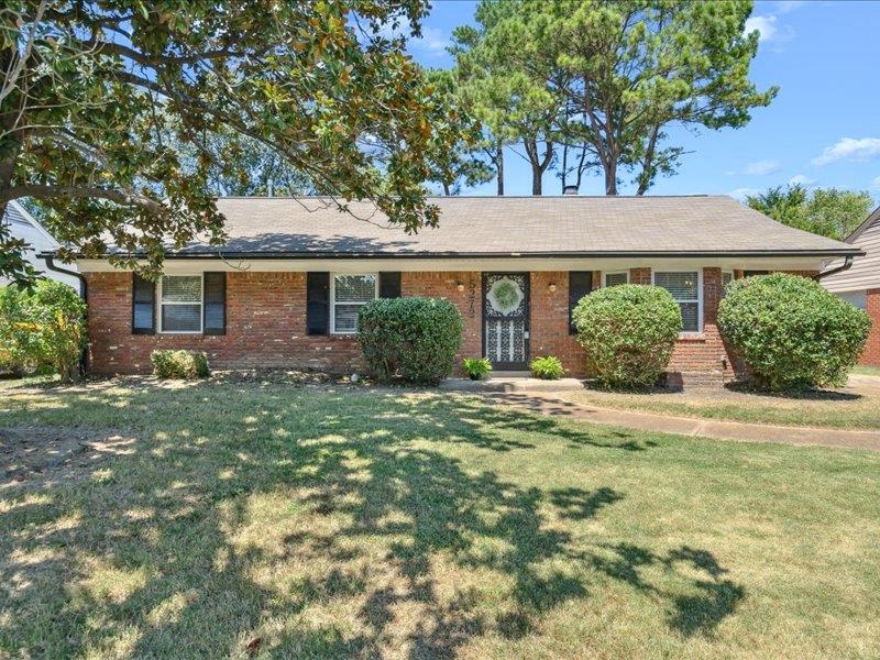 Single story home featuring a front yard