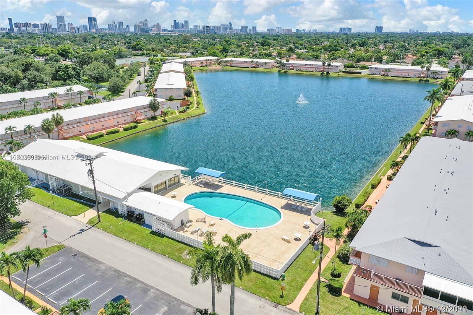 an aerial view of a house with a lake view