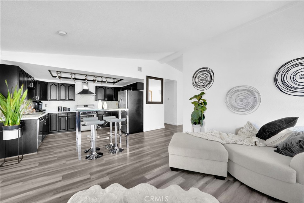 a living room with furniture and a clock