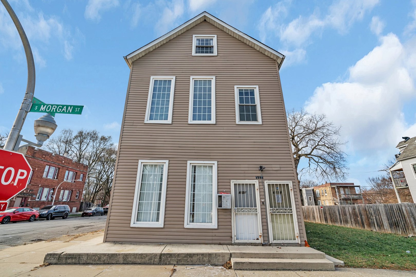 a front view of a house with a yard