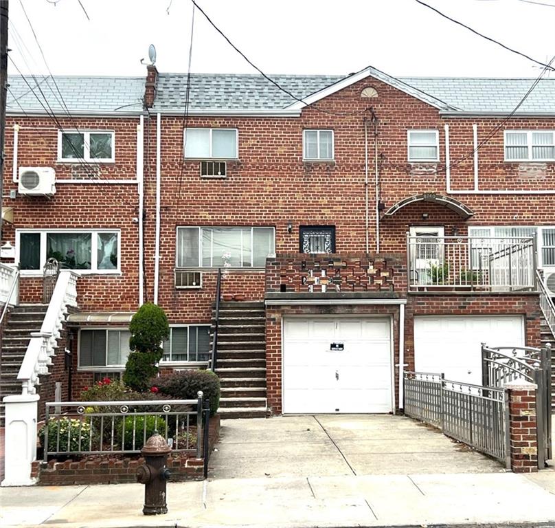 a front view of a house with garage