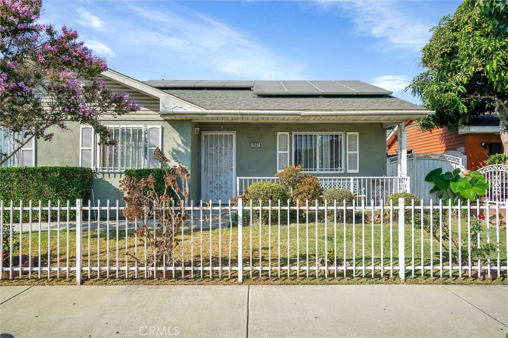 front view of a house with a garden