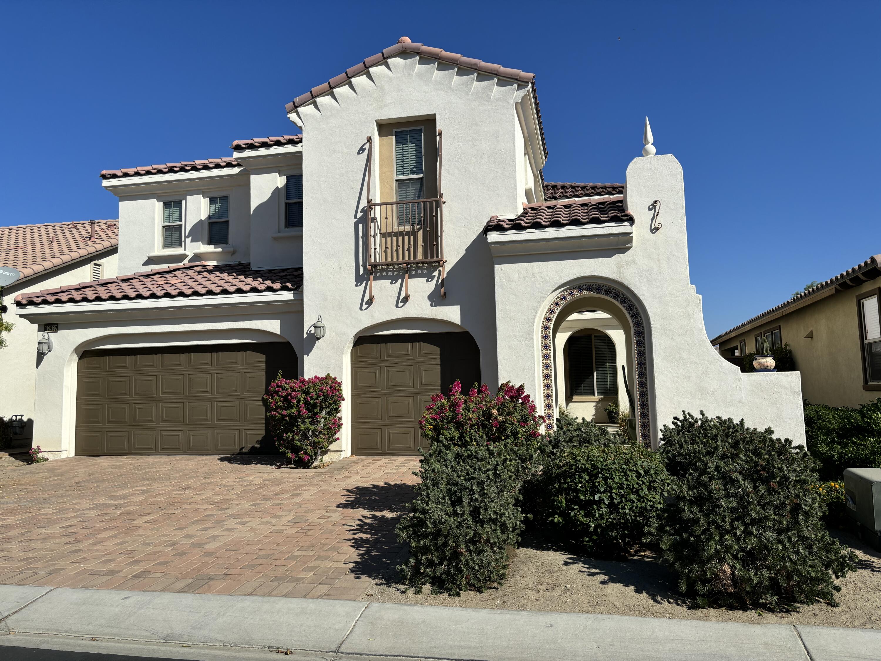 a front view of a house with yard