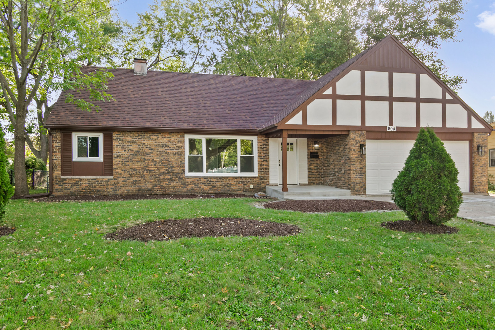 front view of a house with a yard