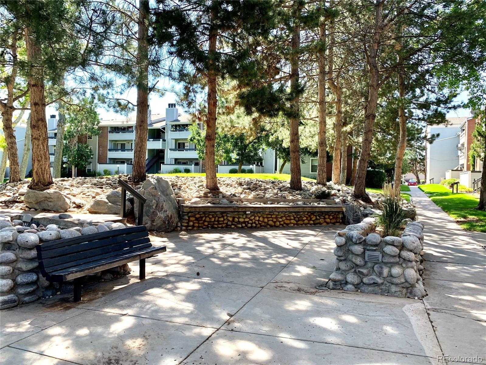 a view of a backyard with sitting area