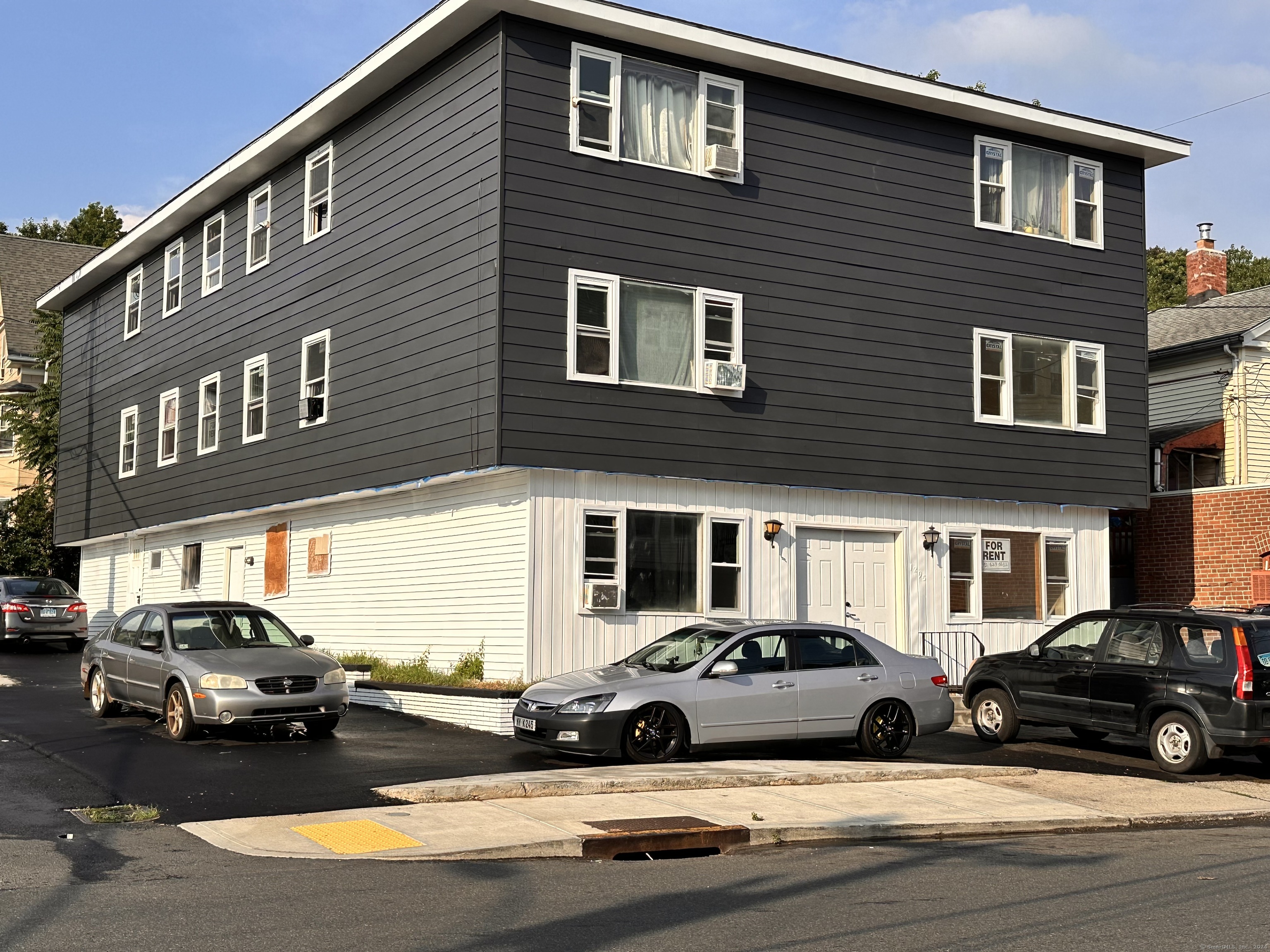 a view of a car park in front of a building