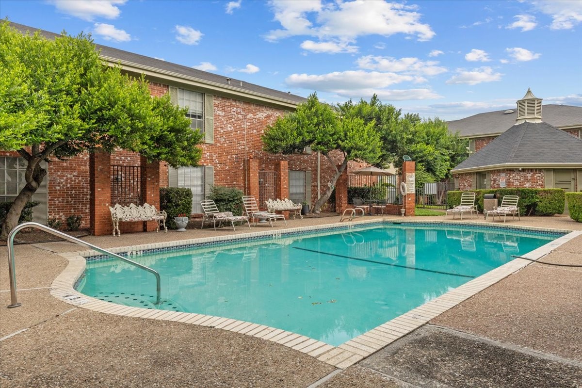 a view of a swimming pool with a patio