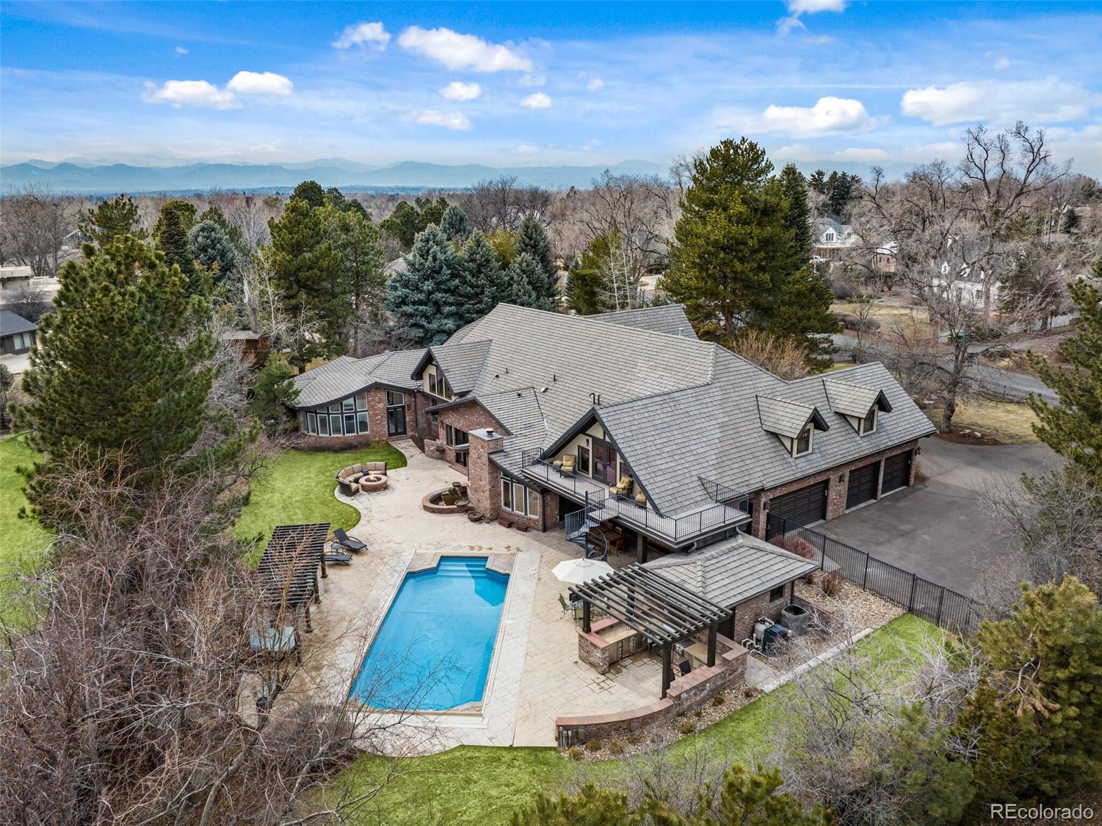 an aerial view of a house with garden space and street view