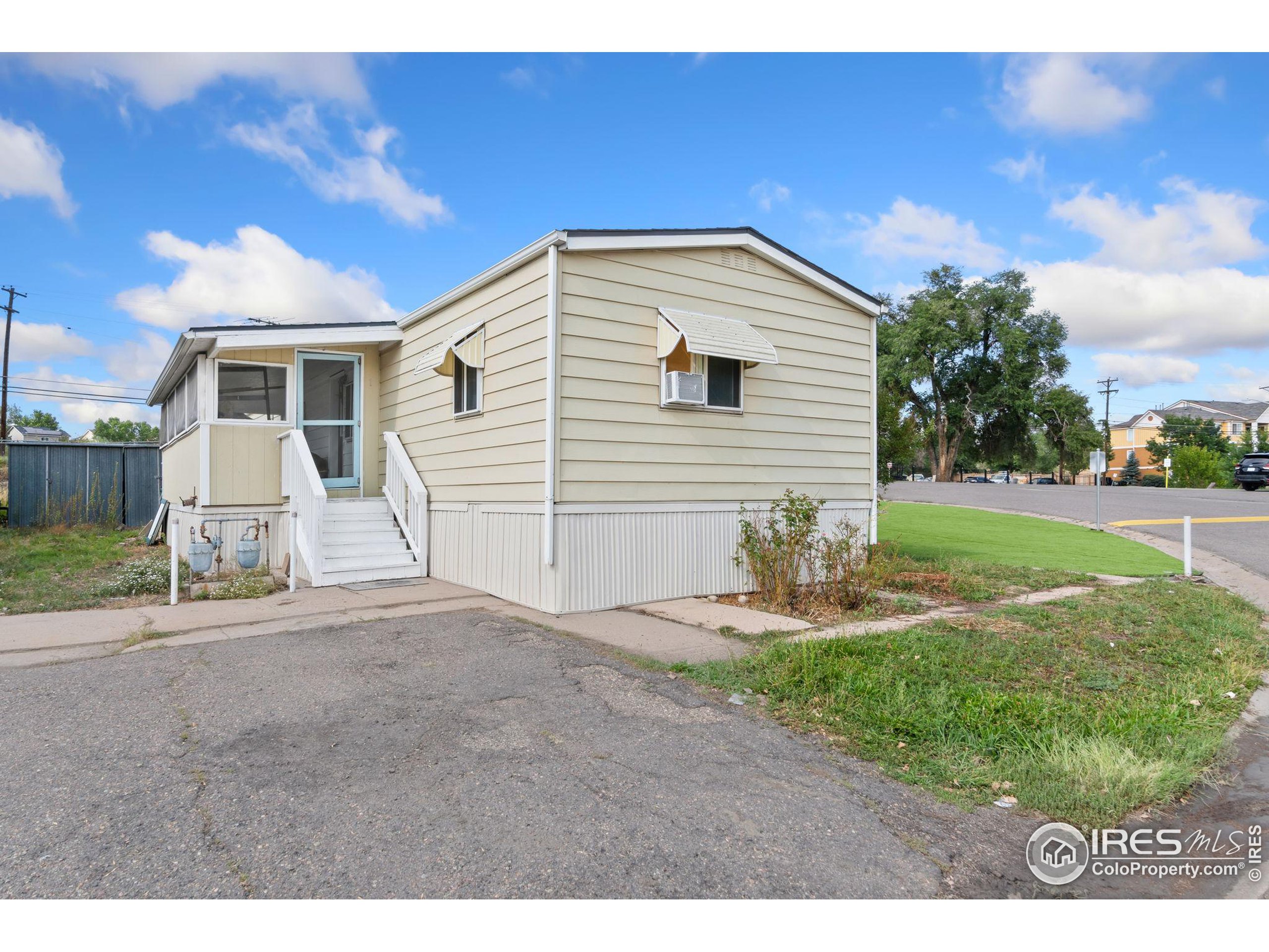 a backyard of a house with yard and garage