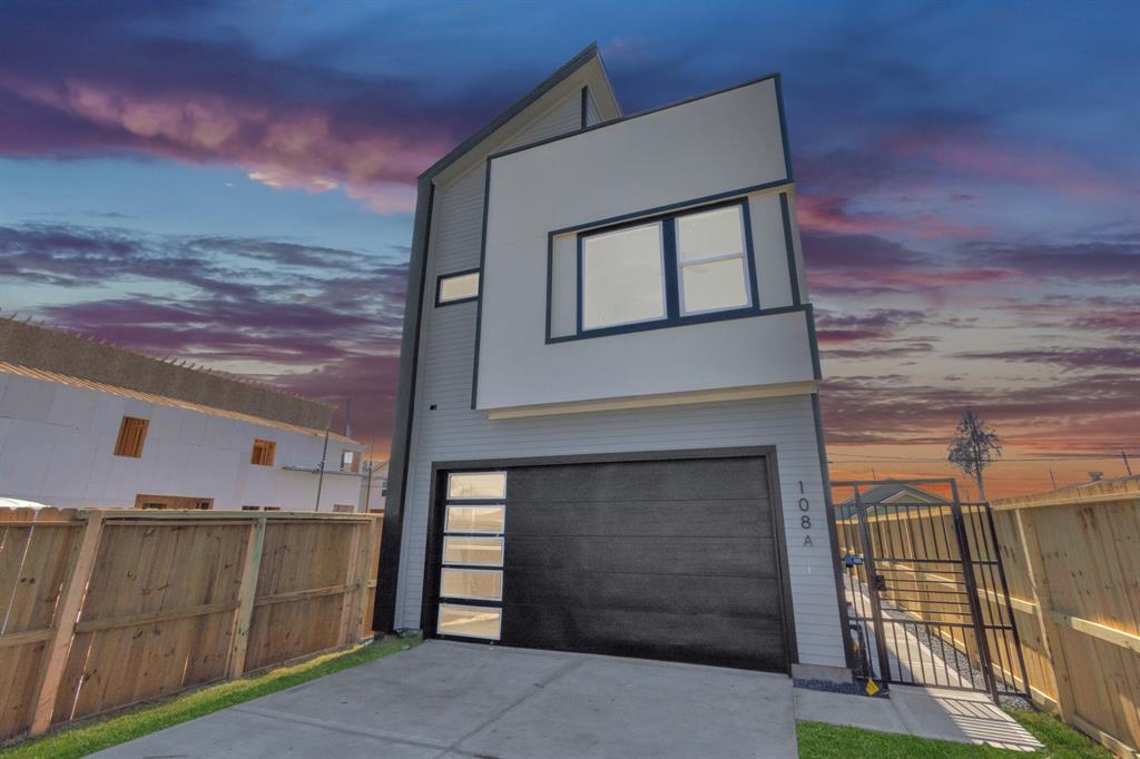 a front view of a house with a garage